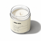 Candle in a glass jar with a label on a white background