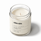 Candle in a glass jar with a label on a white background