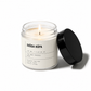 Moss candle in a glass jar with a black lid on a white background