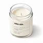 Candle in a glass jar with a label on a white background