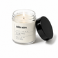 Candle in a glass jar with a label on a white background