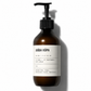 Brown bottle with pump and white label on a white background