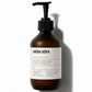Brown bottle with pump and juoda kopa label on a white background