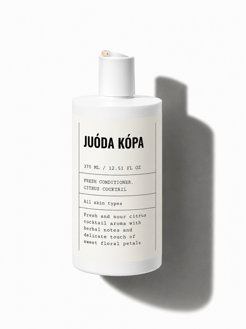 A white bottle of Juóda Kópa Fresh Conditioner with a minimalist black text label, set against a clean white background with a soft shadow cast to the right.